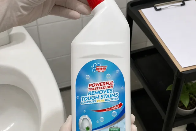 Qiaoshou toilet cleaner bottle held by gloved hands in a bathroom sample-review corner while the red angled cap and bottle neck are checked beside a blank clipboard